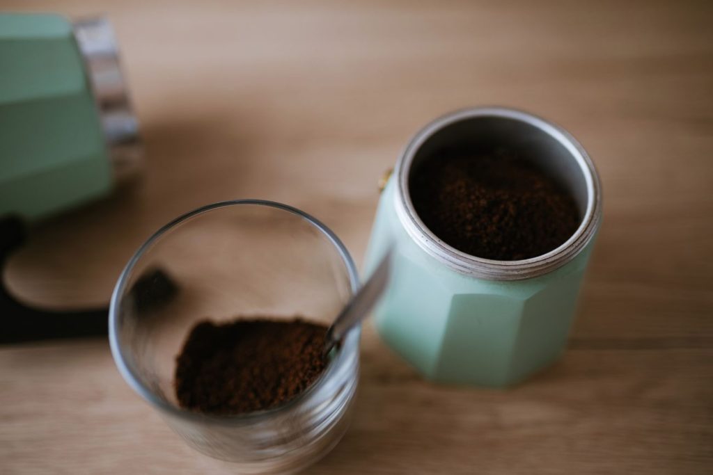 Add coffee grounds to moka pot