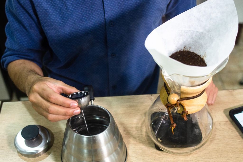 Preparing brewing coffee with chemex coffee maker 