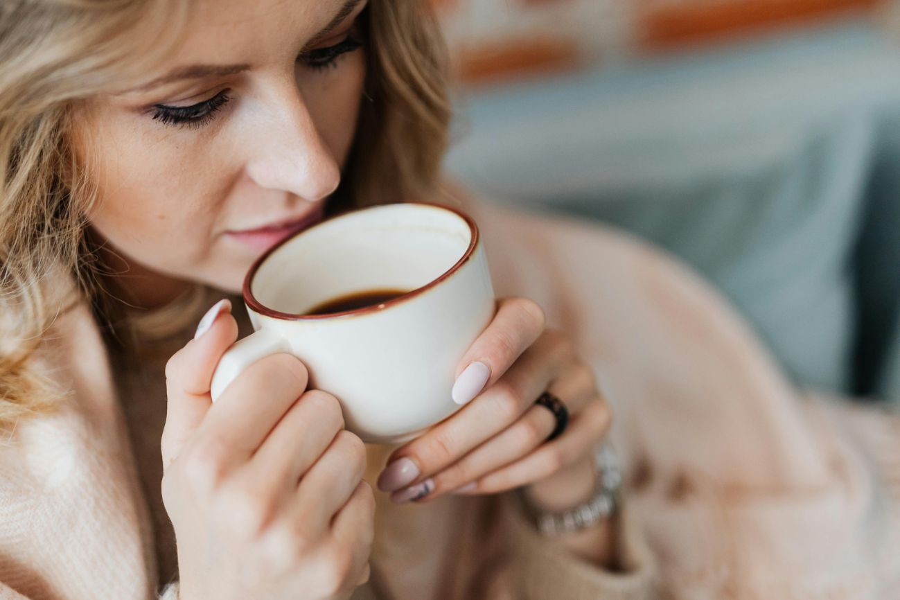 a lady drinking coffee