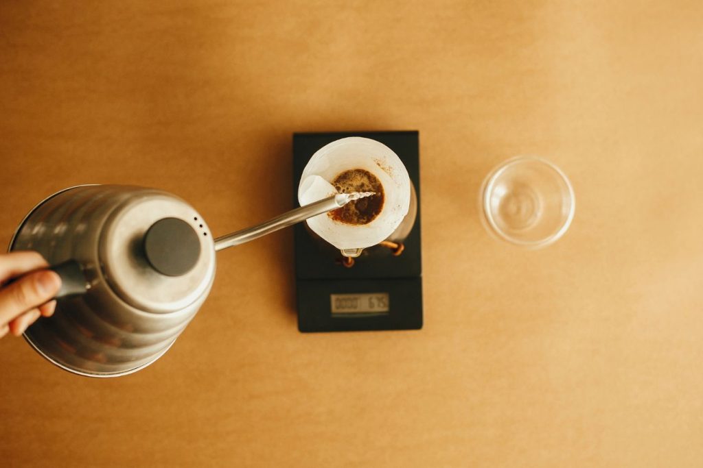 weighing coffee grounds on scale for 1:16 pour-over ratio