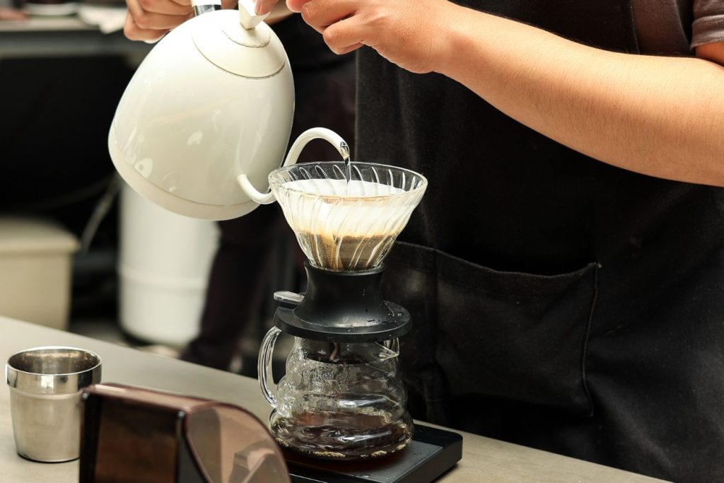pour-over coffee brewing setup with gooseneck kettle and scale